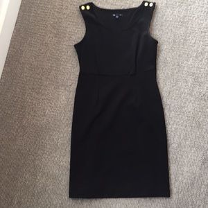 Black sleeveless dress with copper buttons
